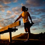 woman-stretching-runner-female-asian-landscape-sunset-yellow